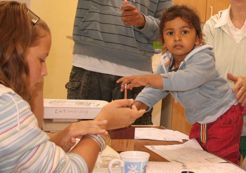 xs.Rajan about to do his recording while Emily inspects her caterpillar.jpg